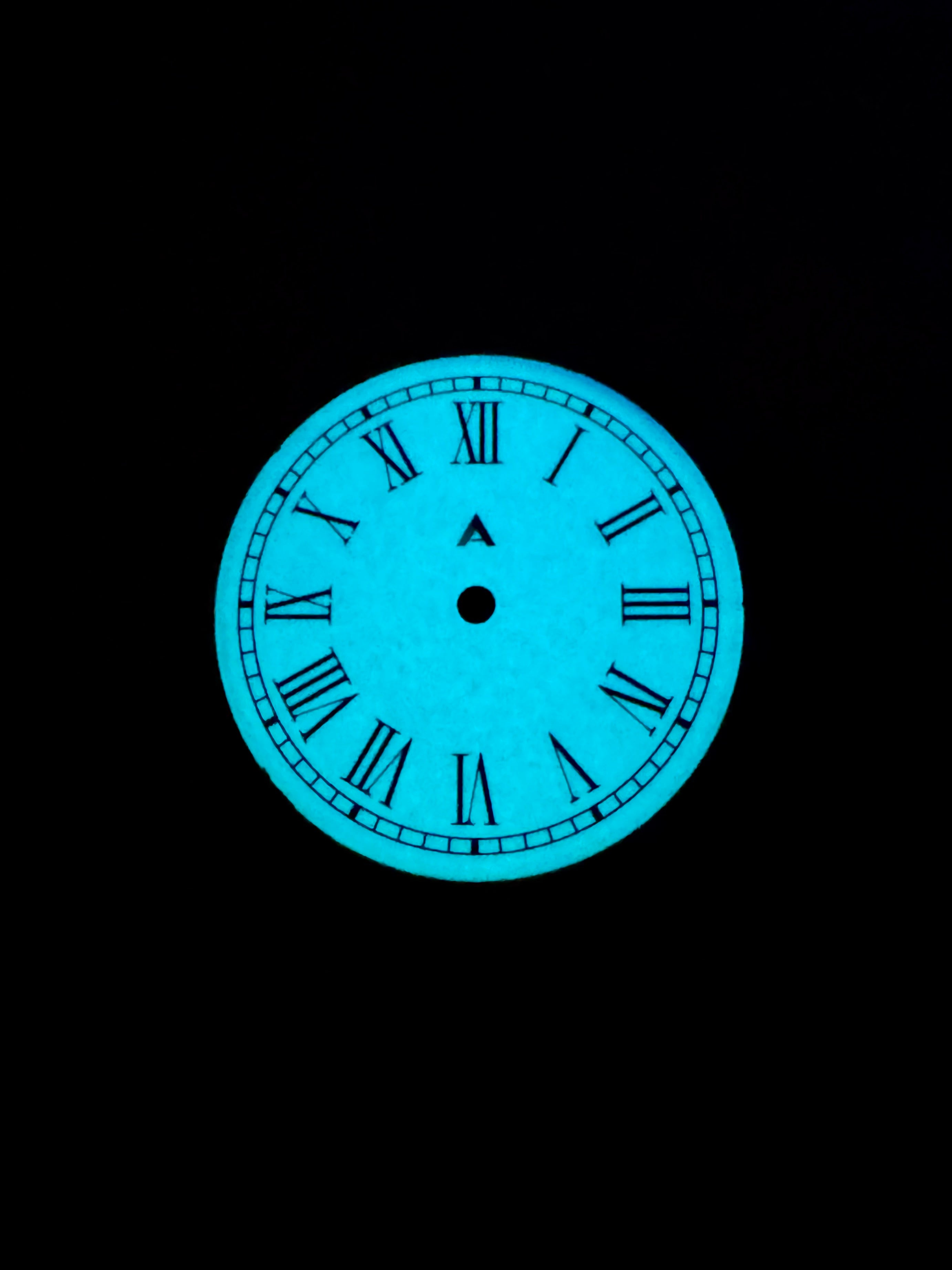 Full lume watch dial with enamel finishing under UV light 