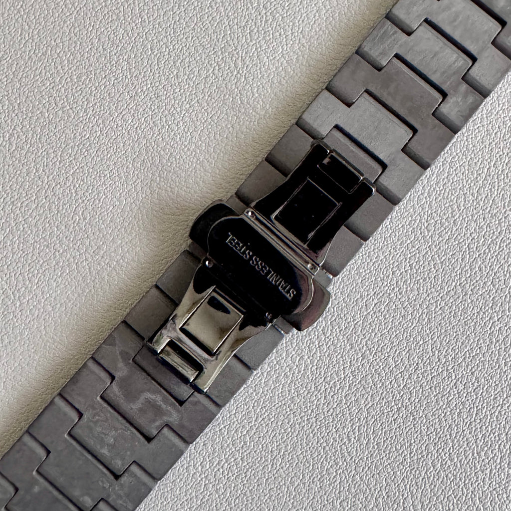Close up of closed PVD black steel butterfly clasp