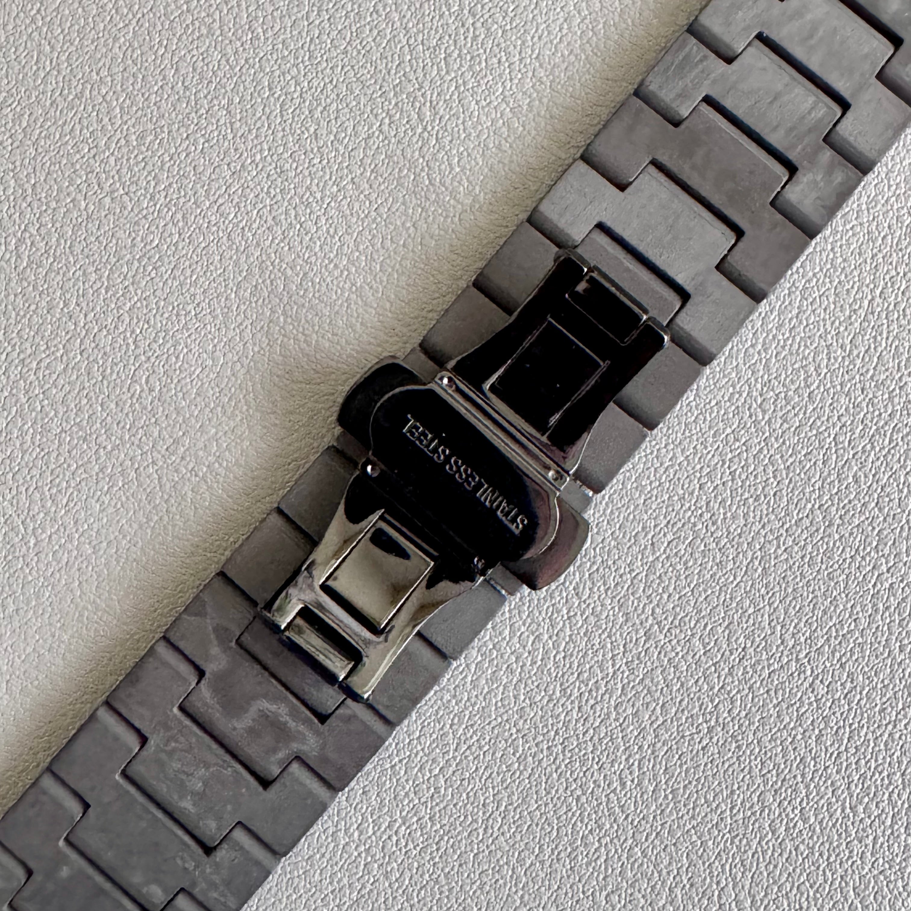 Close up of closed PVD black steel butterfly clasp