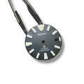 A Seiko SRPB49 navy blue dial for watches, held by two tweezers.
