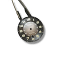 A Seiko SRPC89 OEM watch dial with black background, white numerals, and hands attached, against a white backdrop.