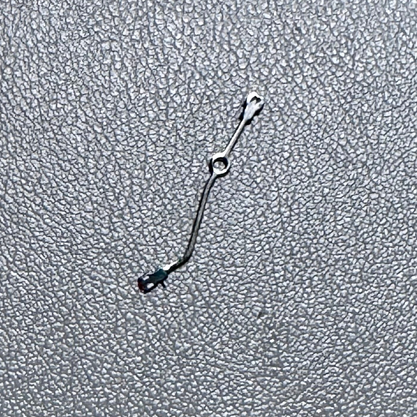 Watch hand for watch modification and assembly on a textured background