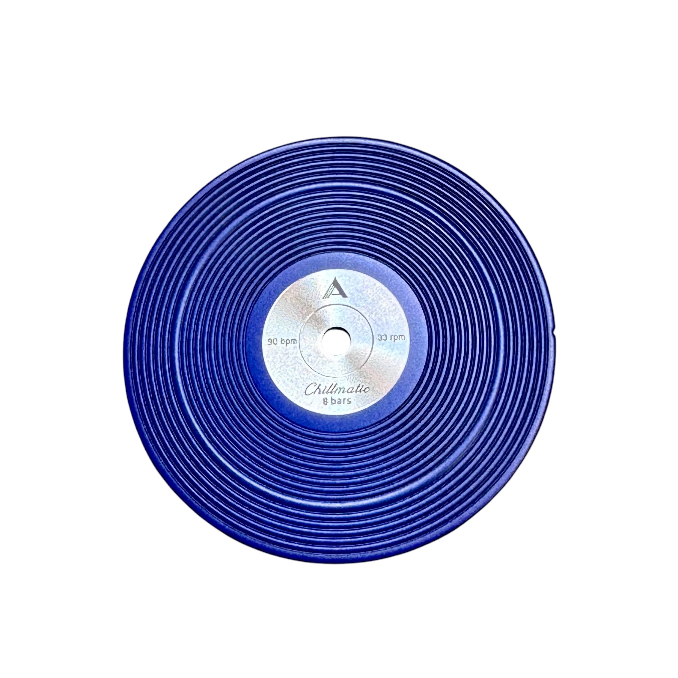 1 vinyl record-style watch dial lying flat on a surface