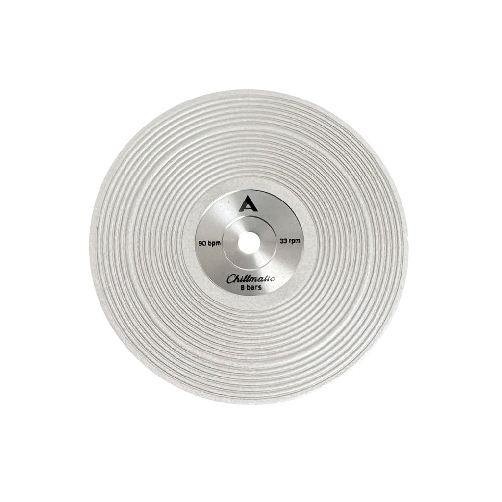 1 vinyl record-style watch dial lying flat on a surface