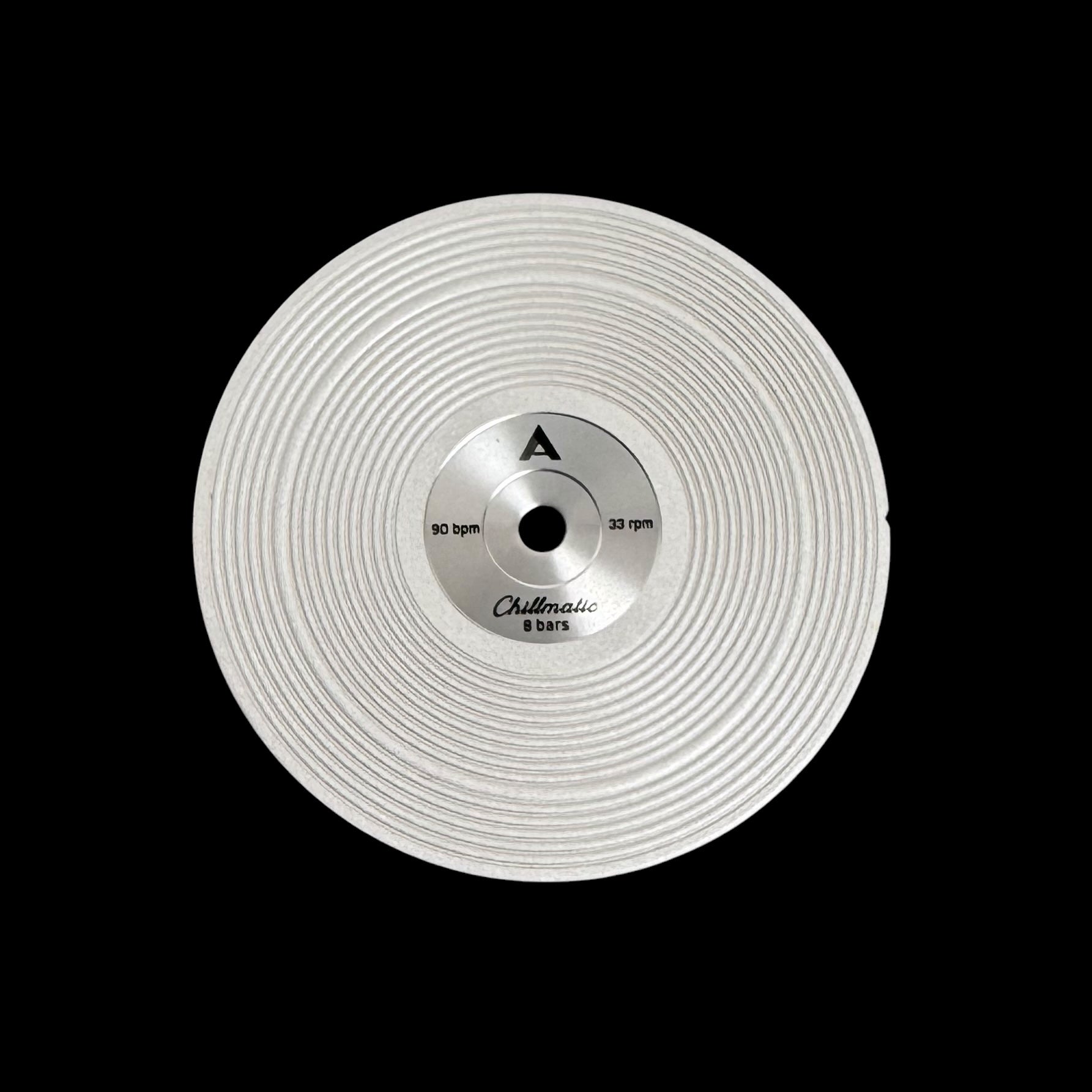 1 vinyl record-style watch dial lying flat on a surface