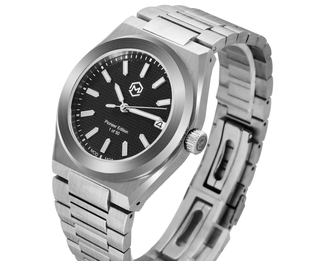 A silver-toned Project MM1 Pioneer Edition watch with a black waffle dial, stainless steel bracelet, and a vulcanised rubber strap.